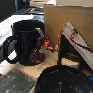 Inductive charger mounted on the coffee mug.